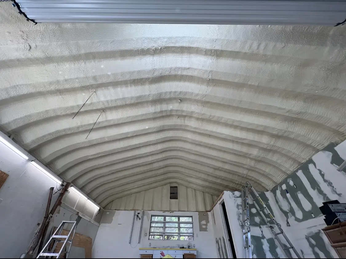 Spray polyurethane foam applied to the underside of a metal roof deck in Kaneohe Base
